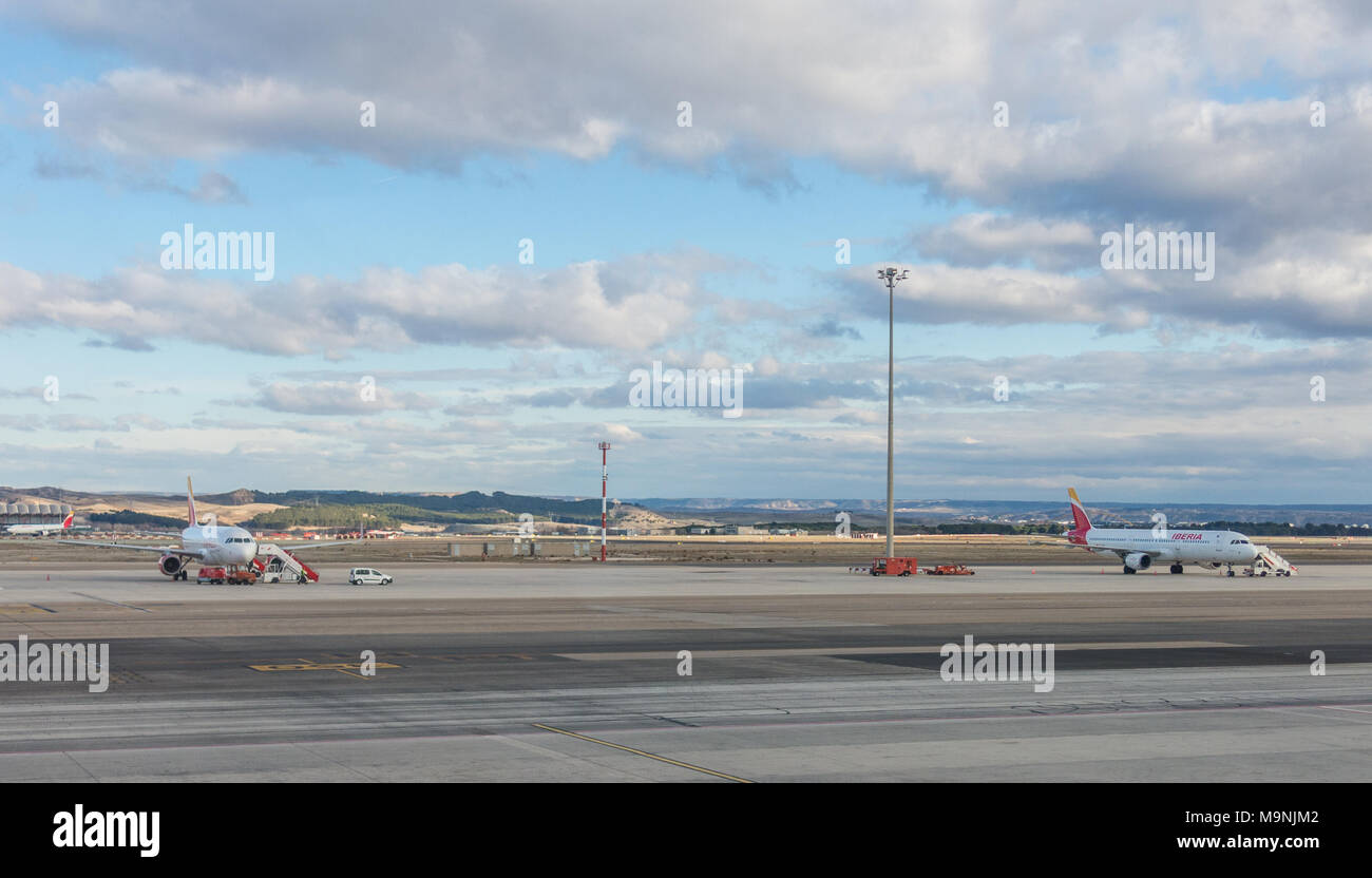 A plane prepares to take off on the runway of Terminal T4 the Adolfo Suarez Madrid Barajas Airport. Barajas is the m Stock Photo