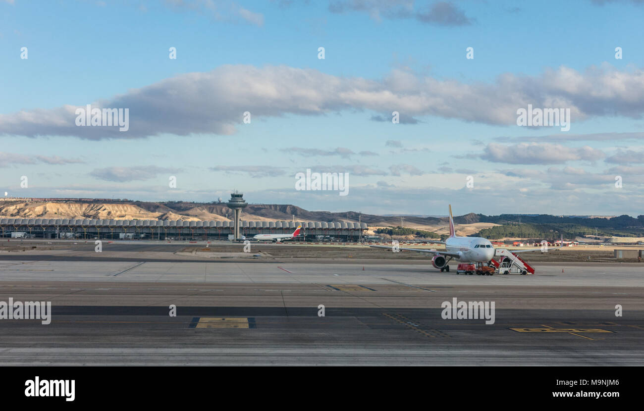 A plane prepares to take off on the runway of Terminal T4 the Adolfo Suarez Madrid Barajas Airport. Barajas is the m Stock Photo