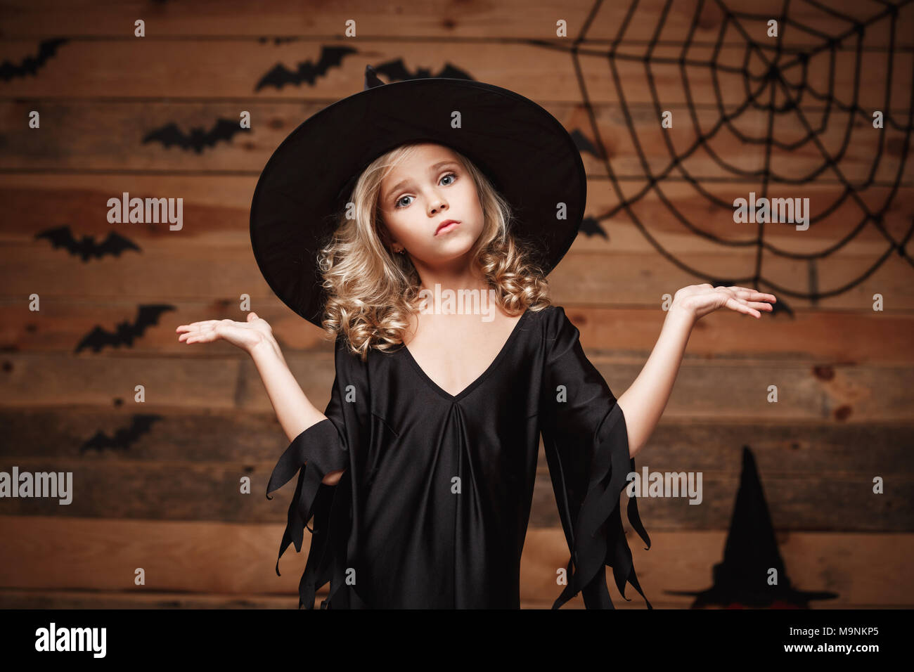 Halloween Witch concept closeup shot of little caucasian witch child