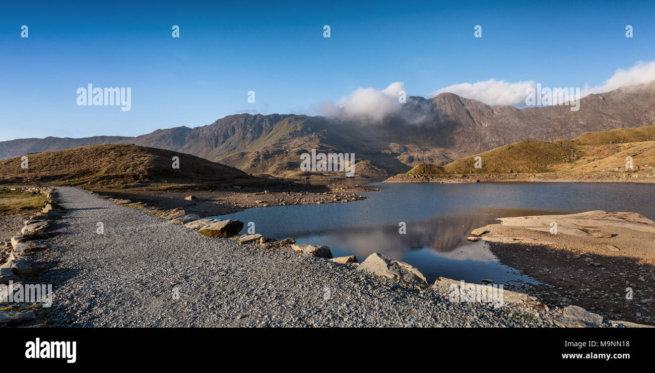The Miners Track and causeway over Llyn Llydaw, Snowdonia, Wales, UK Stock Photo