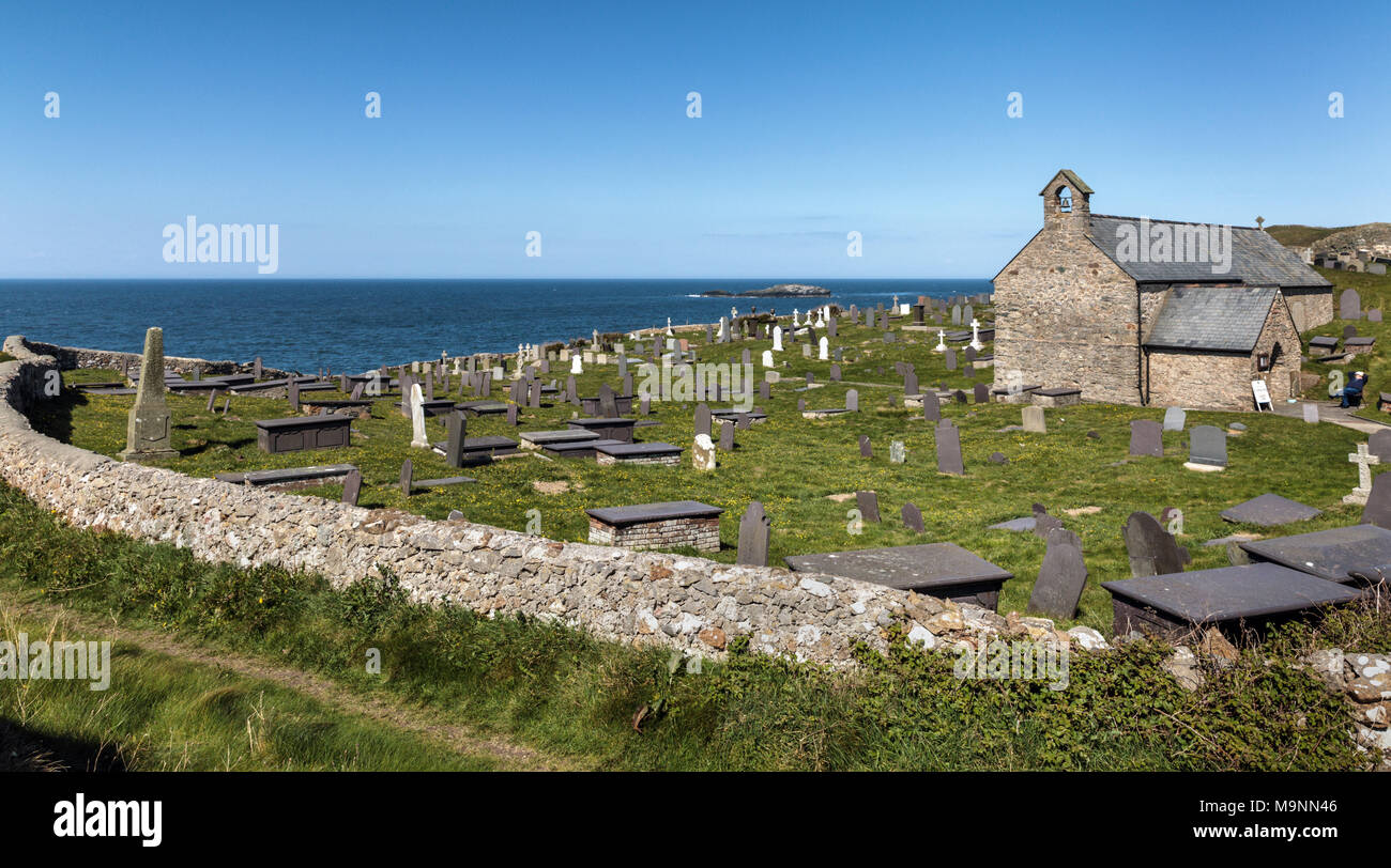 5th century church of St Patrick and graveyard on the coast at Llanbadrig Cemaes Isle of Anglesey North Wales UK Stock Photo