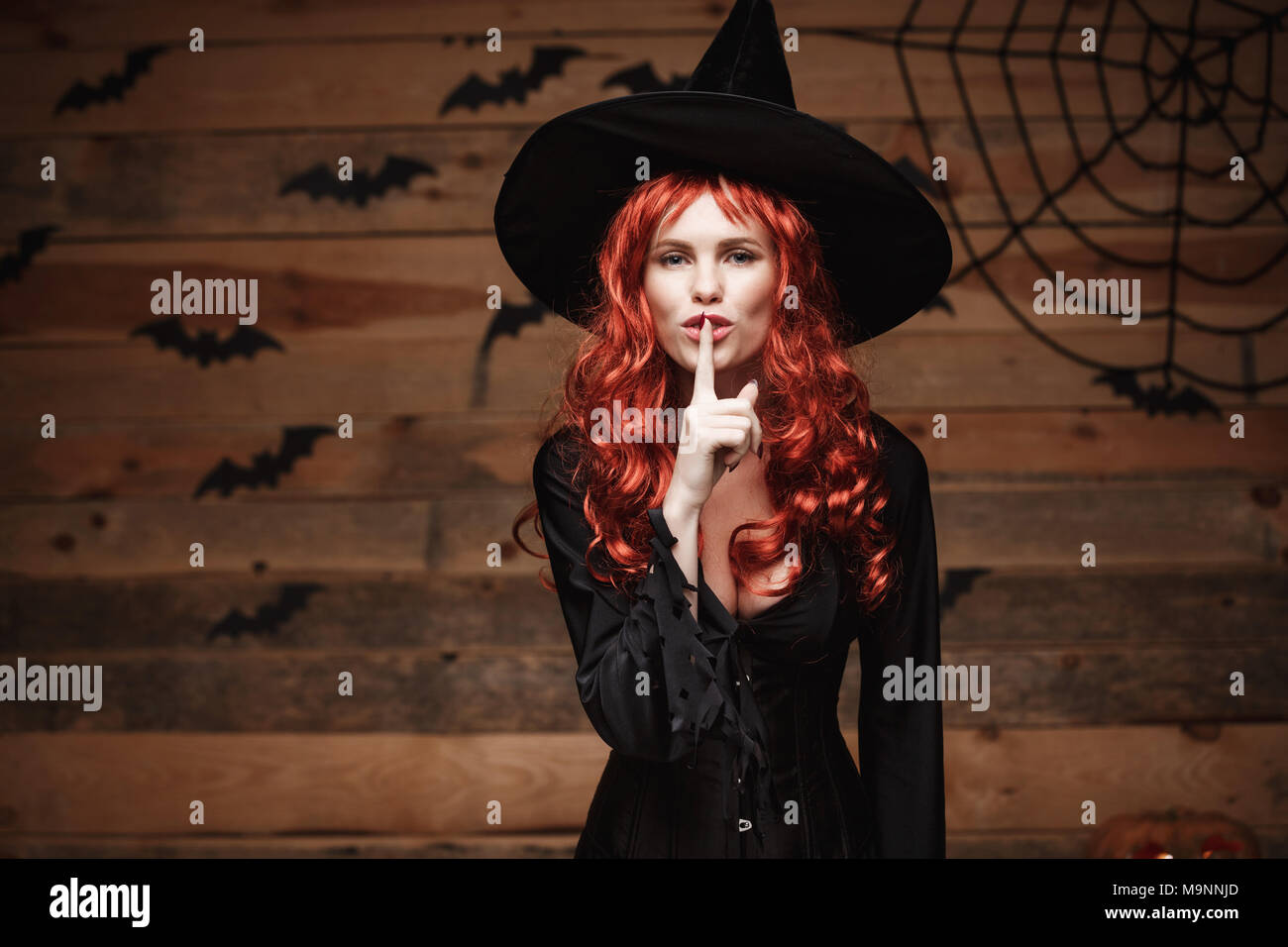 Halloween Witch Concept Happy Halloween Red Hair Witch Doing Silence Gesture With Finger On