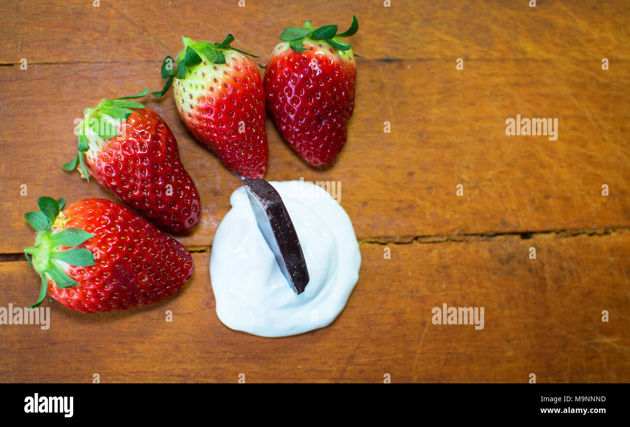 Strawberry with chocolate as fresh bio dessert. Stock Photo