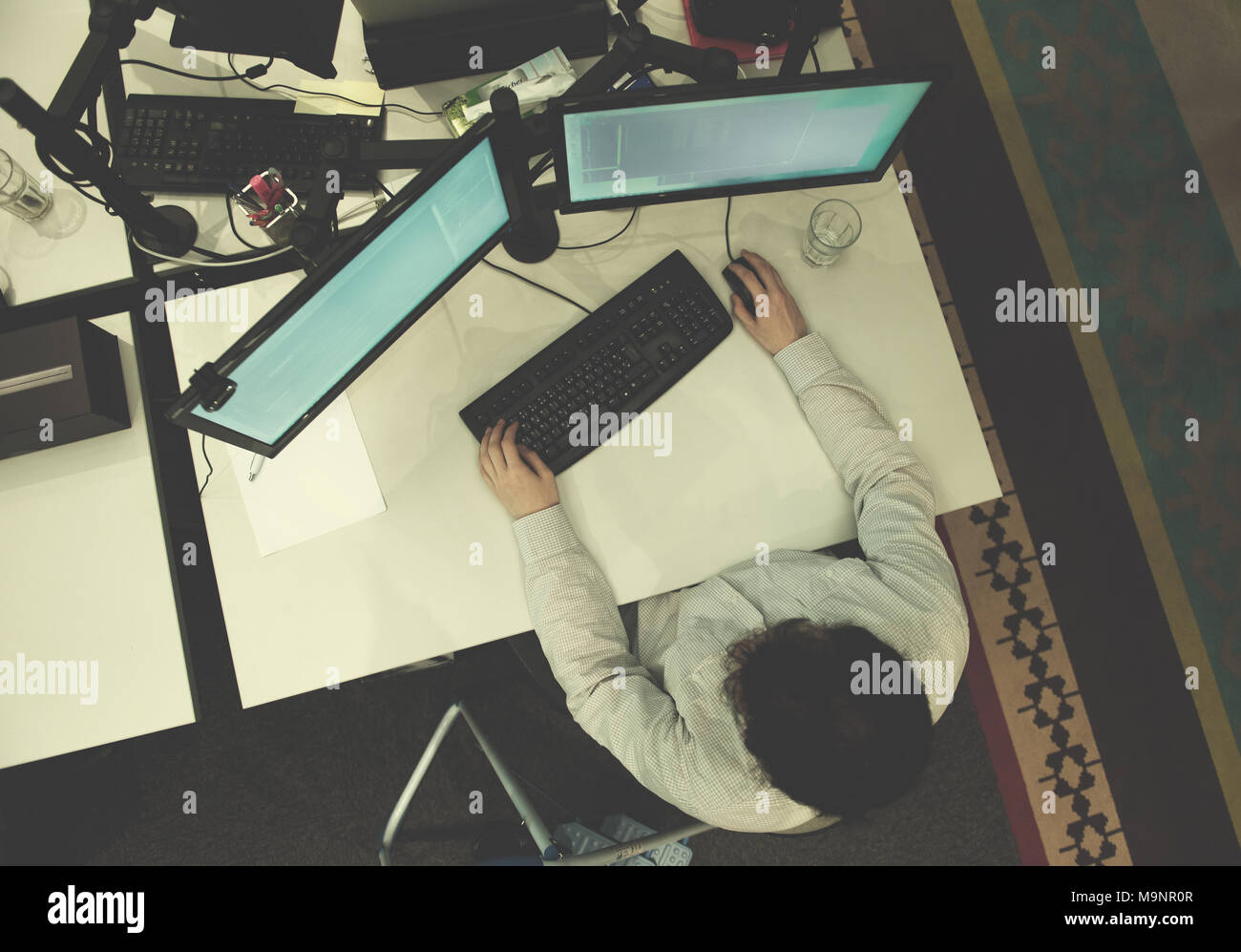 top view of software developer writing programming code on computer Stock Photo