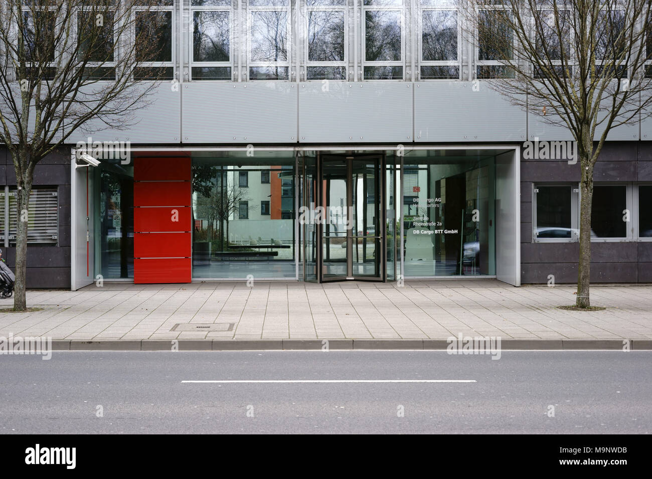 Mainz, Germany - March 17, 2018: The glass entrance of DB Cargo AG headquarters in Mainz with a modern entrance with revolving door on March 17, 2018  Stock Photo