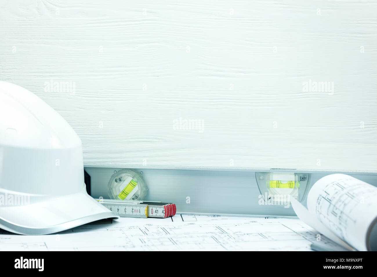 Digging Safety Equipment Ruler contractor tools and instruments closeup. safety helmet, rolled ...