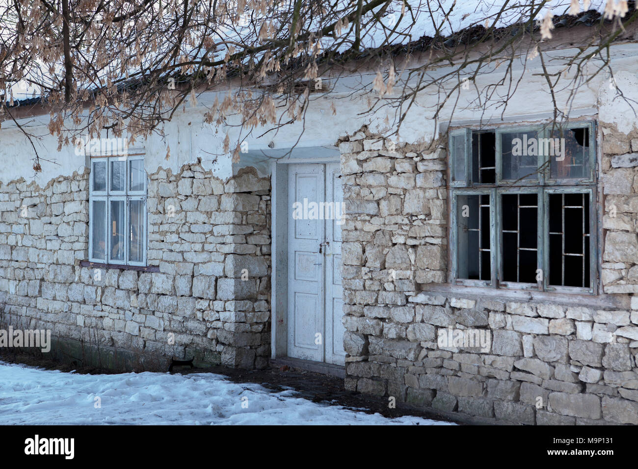 House with in the ancient stone wall white isolated Stock Photo - Alamy