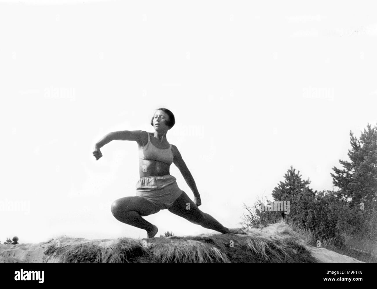 Woman doing outdoor gymnastics, 1940s, exact place unknown, Germany Stock Photo