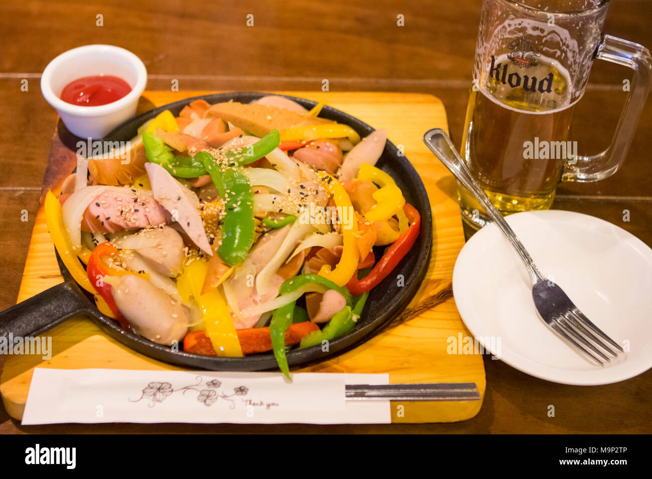 A typical dish of South Korea to eat with beer after skiing: grilled sausage and sweet peppers. The Alpensia Resort is a ski resort and a tourist attraction. It is located on the territory of the township of Daegwallyeong-myeon, in the county of Pyeongchang, hosting the Winter Olympics in February 2018. The ski resort is approximately 2.5 hours from Seoul or Incheon Airport by car, predominantly all motorway. Alpensia has six slopes for skiing and snowboarding, with runs up to 1.4 km (0.87 mi) long, for beginners and advanced skiers, and an area reserved for snowboarders. While the resort Stock Photo