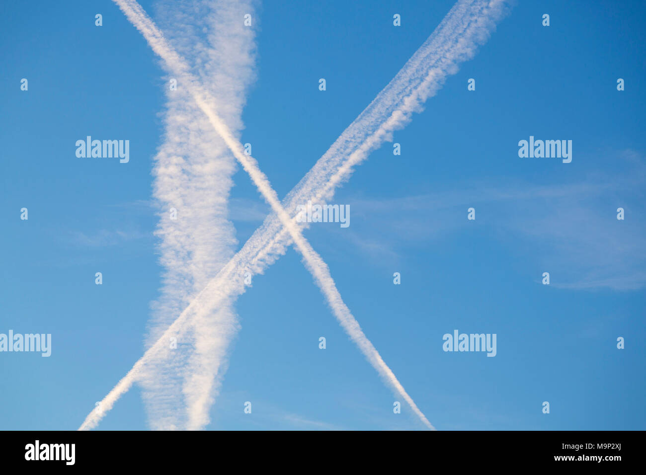 Contrail, emission of carbon dioxide in the sky Stock Photo