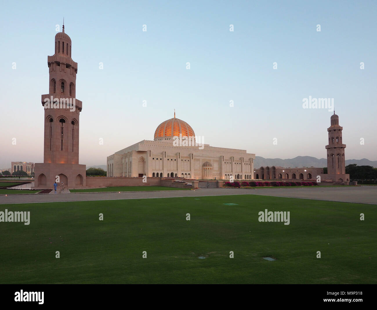 Evening atmosphere, Great Sultan Qabus Mosque with minarets, Muscat, Oman Stock Photo