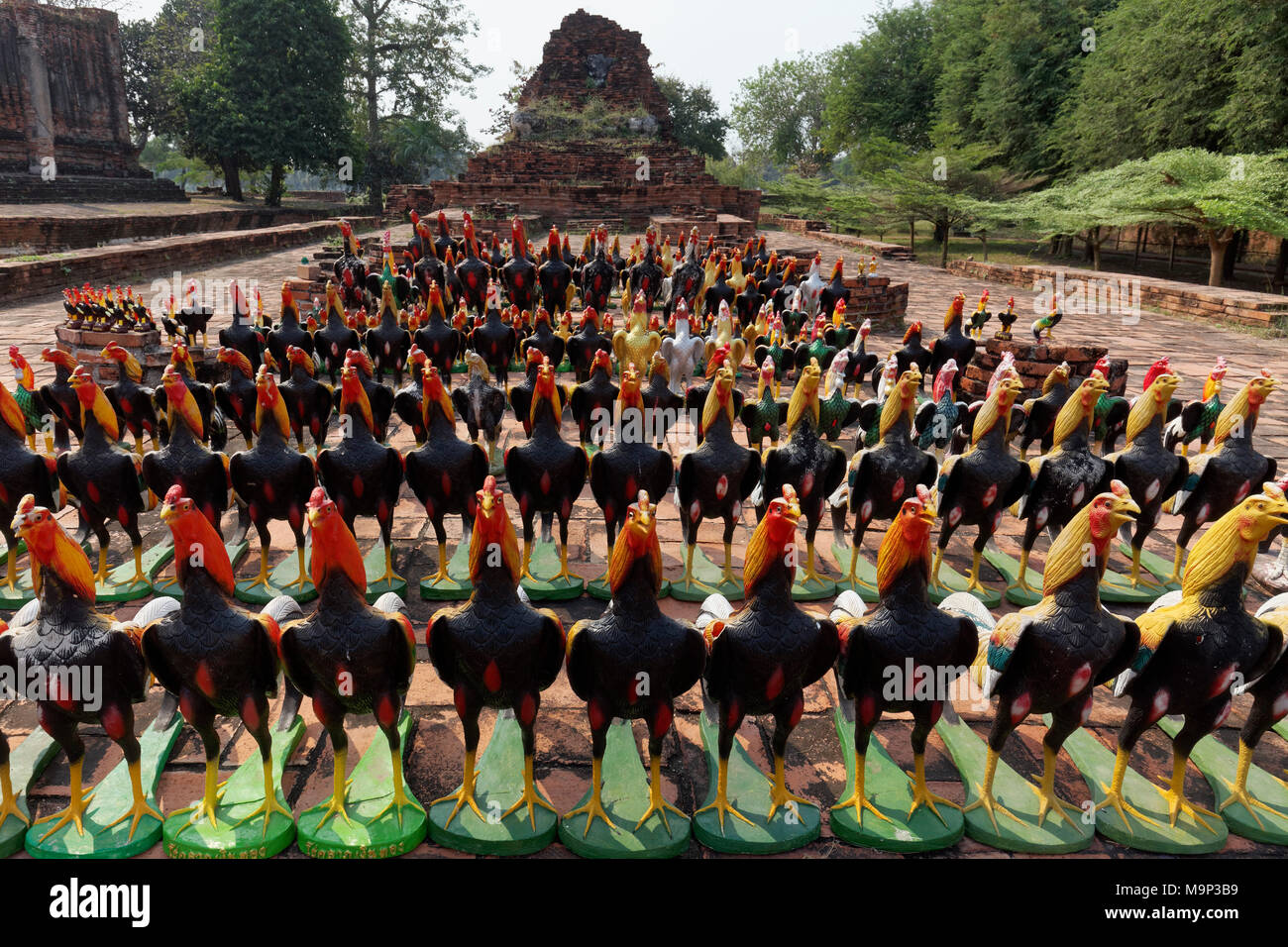 Rooster figures lined up in front of a Buddhist temple, souvenirs, Wat Thammikarat, Ayutthaya History Park, Ayutthaya, Thailand Stock Photo