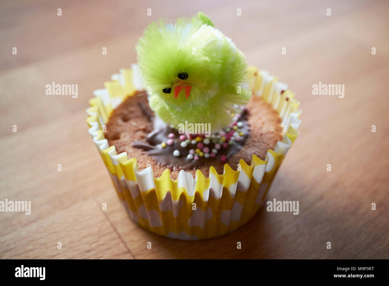 Small Fairy Cake Decorated With An Easter Chick In School By Young Child Small Fairy Cake Decorated With An Easter Chick In School By Young Child