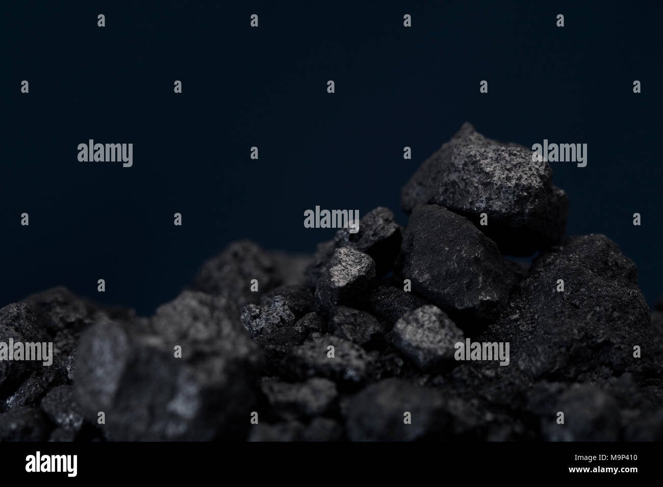 Petroleum coke is a carbonaceous material that results from the coking process during upgrading bitumen. Petroleum coke has uses in the electric power and industrial sectors. Stock Photo