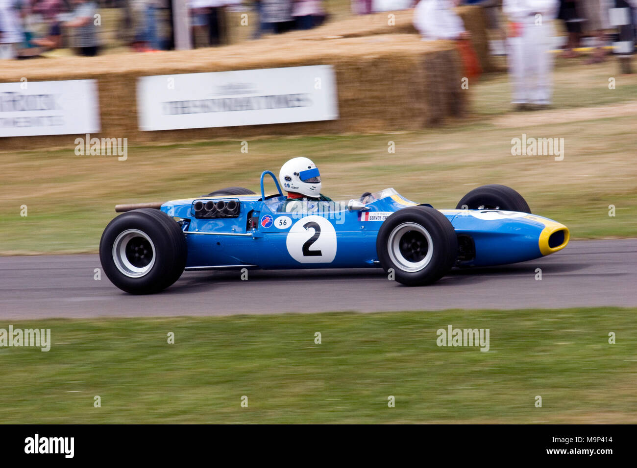 Blue and yellow vintage classic racingcar. Single seat / seater F1 racing or driving. Stock Photo