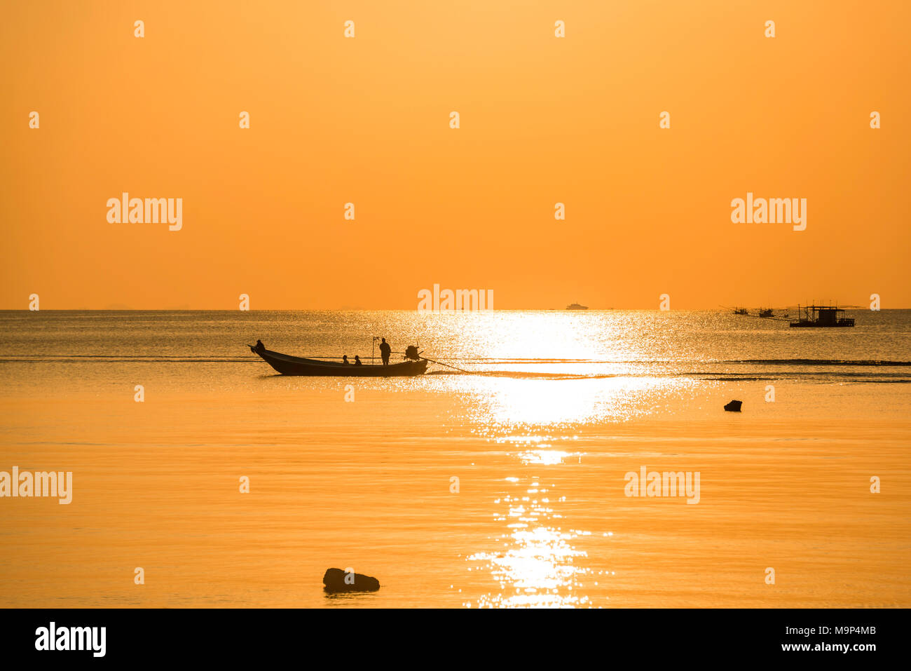 Sunset at sea, longtail boat, fishing boat, Ko Pha-ngan, Gulf of Thailand, Thailand Stock Photo