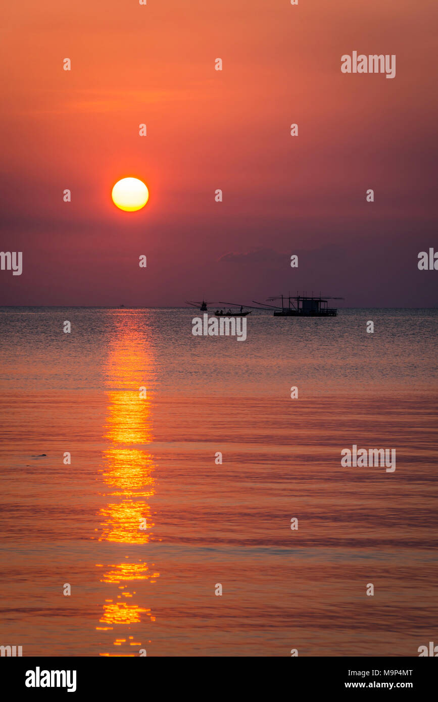 Sunset at sea, longtail boat, fishing boat, Ko Pha-ngan, Gulf of Thailand, Thailand Stock Photo