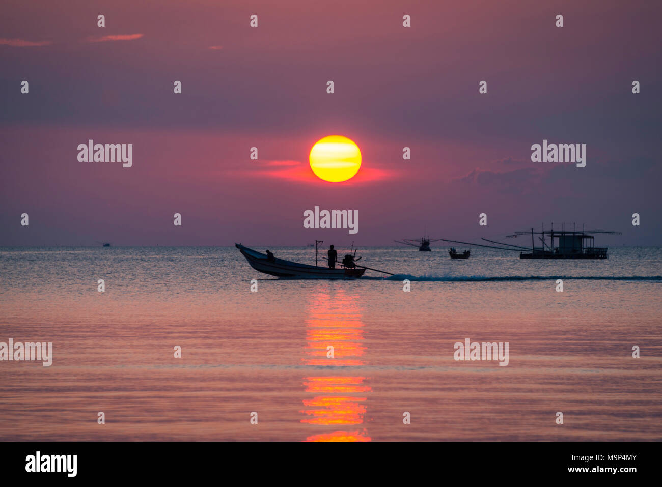 Sunset at sea, longtail boat, fishing boat, Ko Pha-ngan, Gulf of Thailand, Thailand Stock Photo