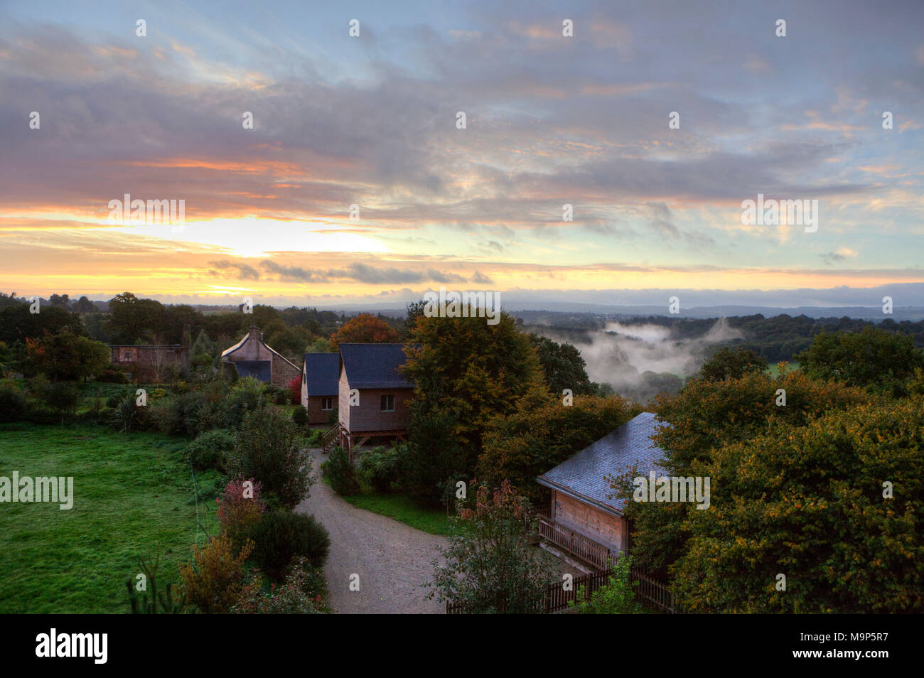 Early morning fog at Domaine de Mero, Plonevez-du-Faou, Brittany, France Stock Photo