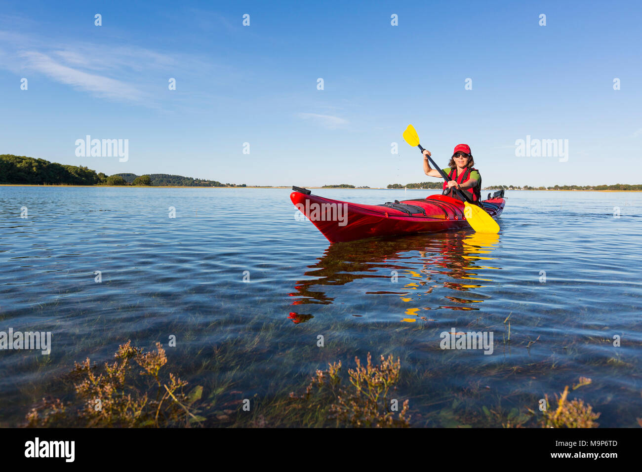 Kayaker on Essex River at Cox Reservation in Essex, Massachusetts Stock Photo