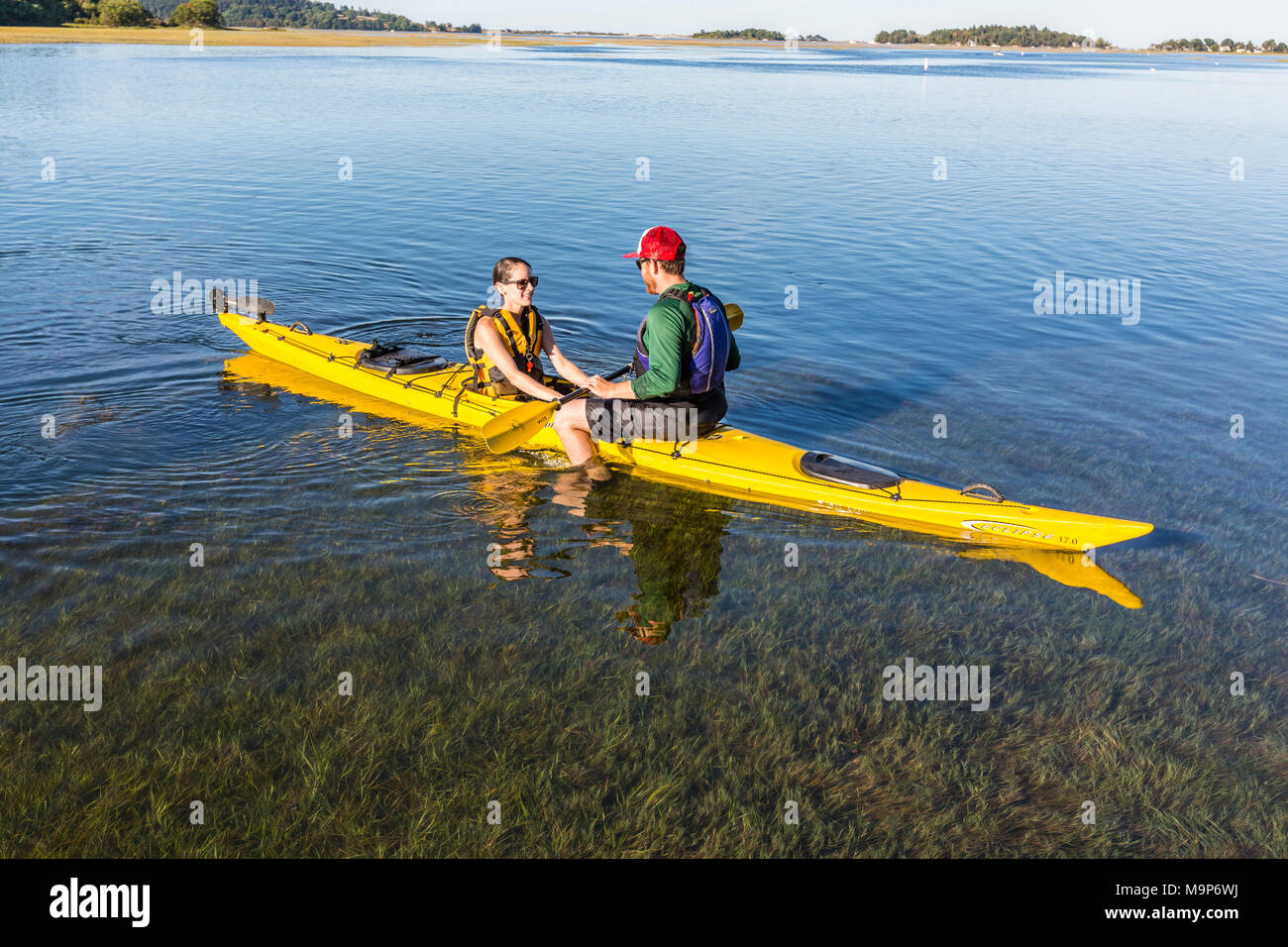 Couple on kayak on Essex River at Cox Reservation in Essex, Massachusetts Stock Photo