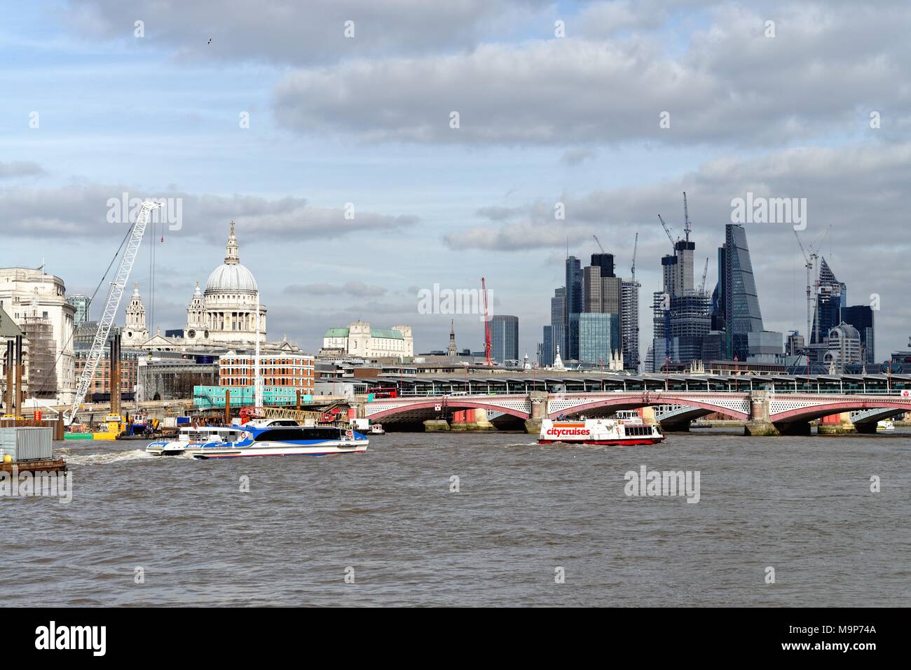 Skyline of the City of London showing ongoing construction projects and the River Thames England UK Stock Photo