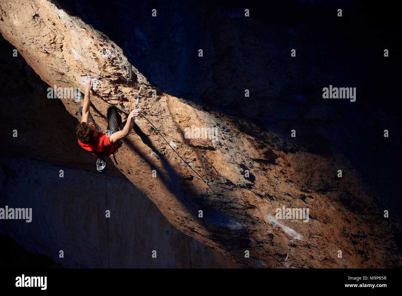 Italian professional climber Stefano Ghisolfi on a week long trip to Spain while shooting stills and videos for his new sponsor The North Face. During the trip he climbed La Rambla, 9a+ in Siurana in just 4 attempts and 2 days. Photos on La Rambla are lit with a strobe hand held by Jacopo Larcher on the first day and Lena Drapella on the second. On the second half of the trip we shot action and lifestyle around Stefanos ascent of First Round First minute, 9b in Margalef. We also shot some images on Meconi, 8a. Stock Photo