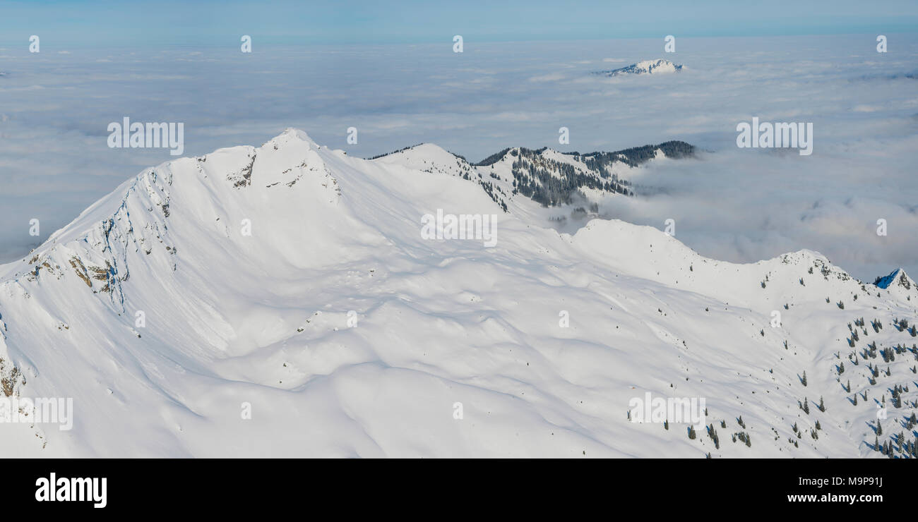 Panorama in winter, snow-covered mountains above cloud blanket, Nebelhorn, 2224m, Rubihorn, 1957m and Grünten, 1783m Stock Photo