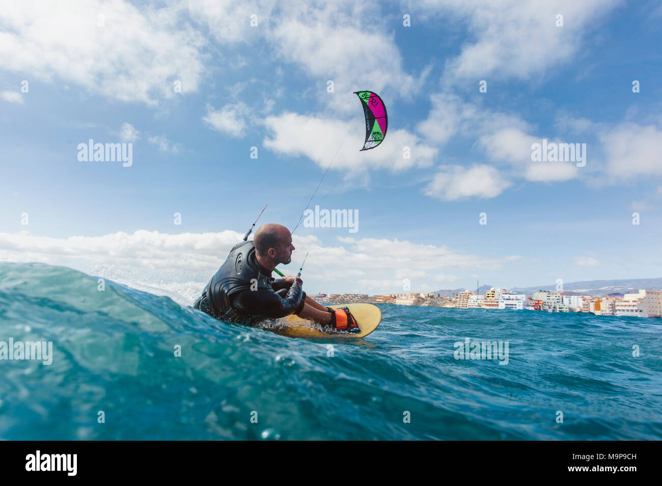 Action photo of a handicapped kite surfer Stock Photo