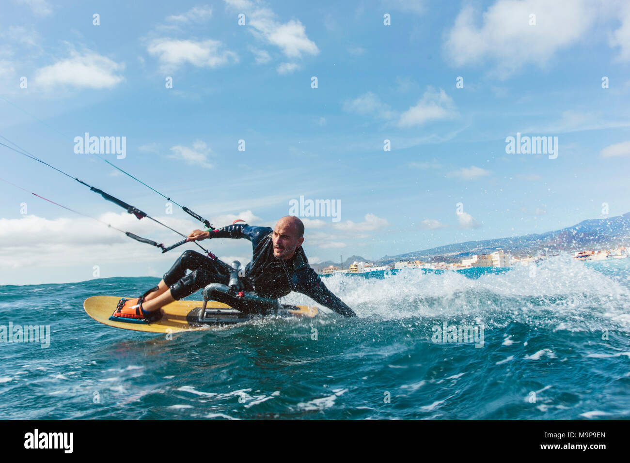 Action photo of a handicapped kite surfer Stock Photo