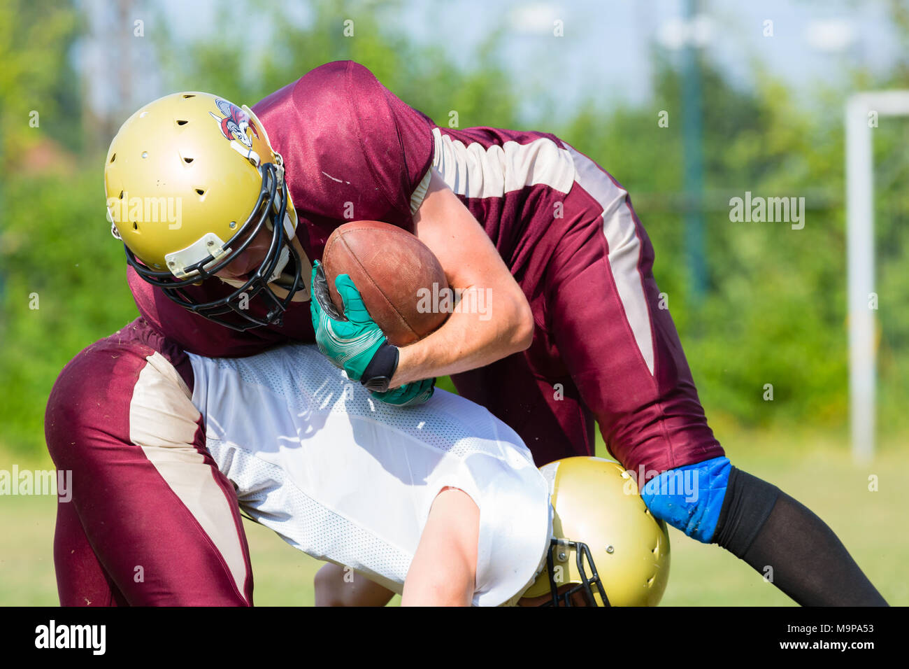 Attack at American Football Game being blocked Stock Photo Alamy