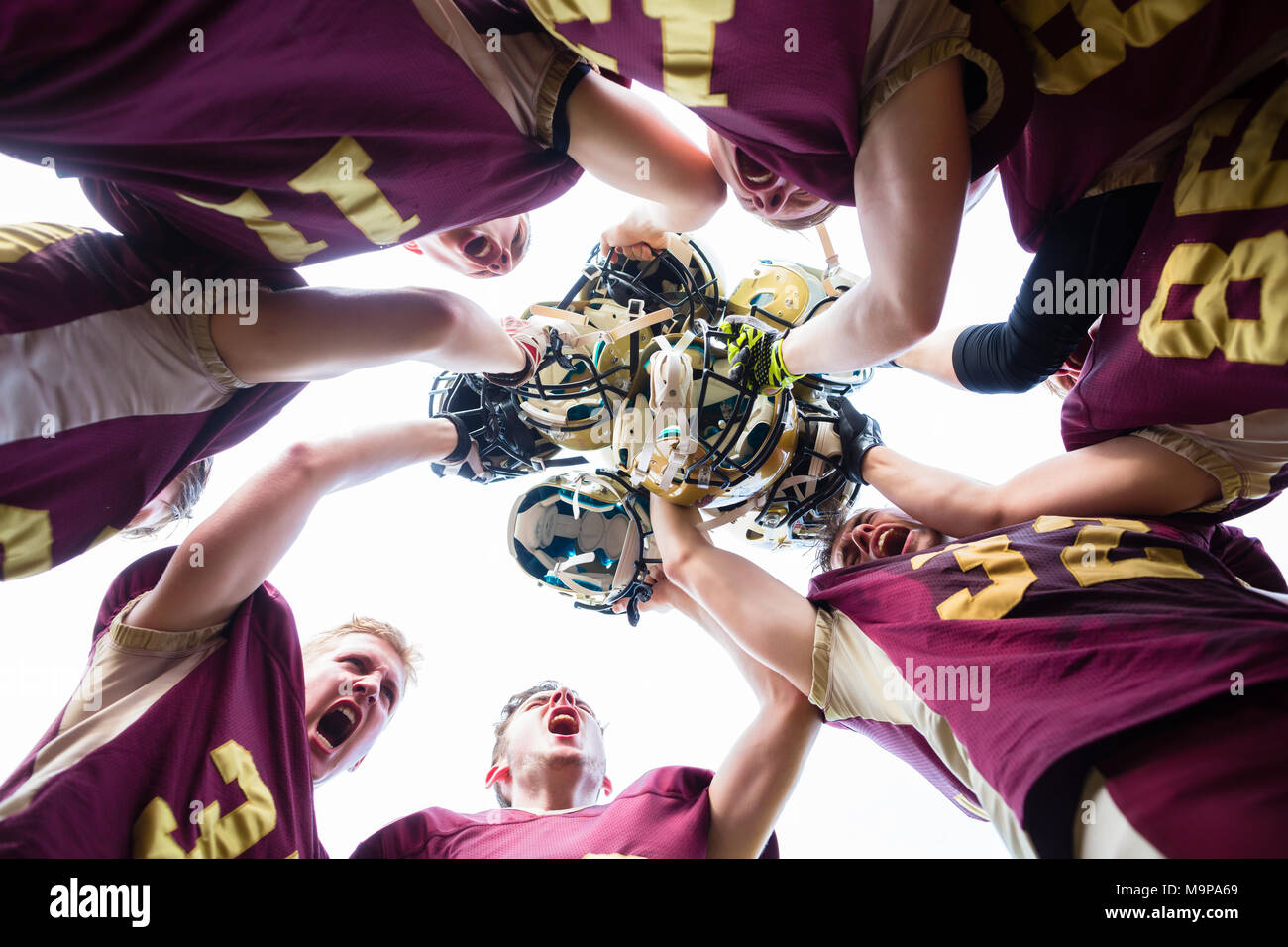 Huddle after victory at American Football Team Stock Photo Alamy