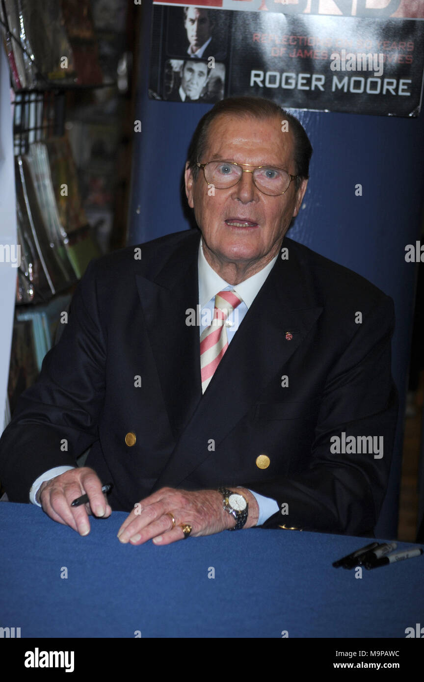 NEW YORK, NY - NOVEMBER 09:  Sir Roger Moore meets fans and signs copies of his book 'Bond on Bond' on November 9, 2012 in New York City.   People:  Sir Roger Moore Stock Photo