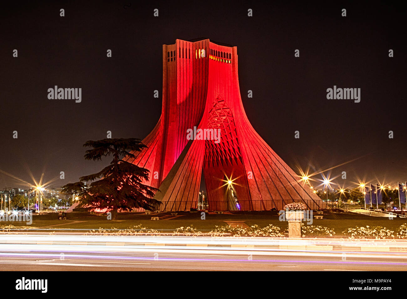 Red illuminated Liberty Tower, Azadi Tower, Theran, Iran Stock Photo