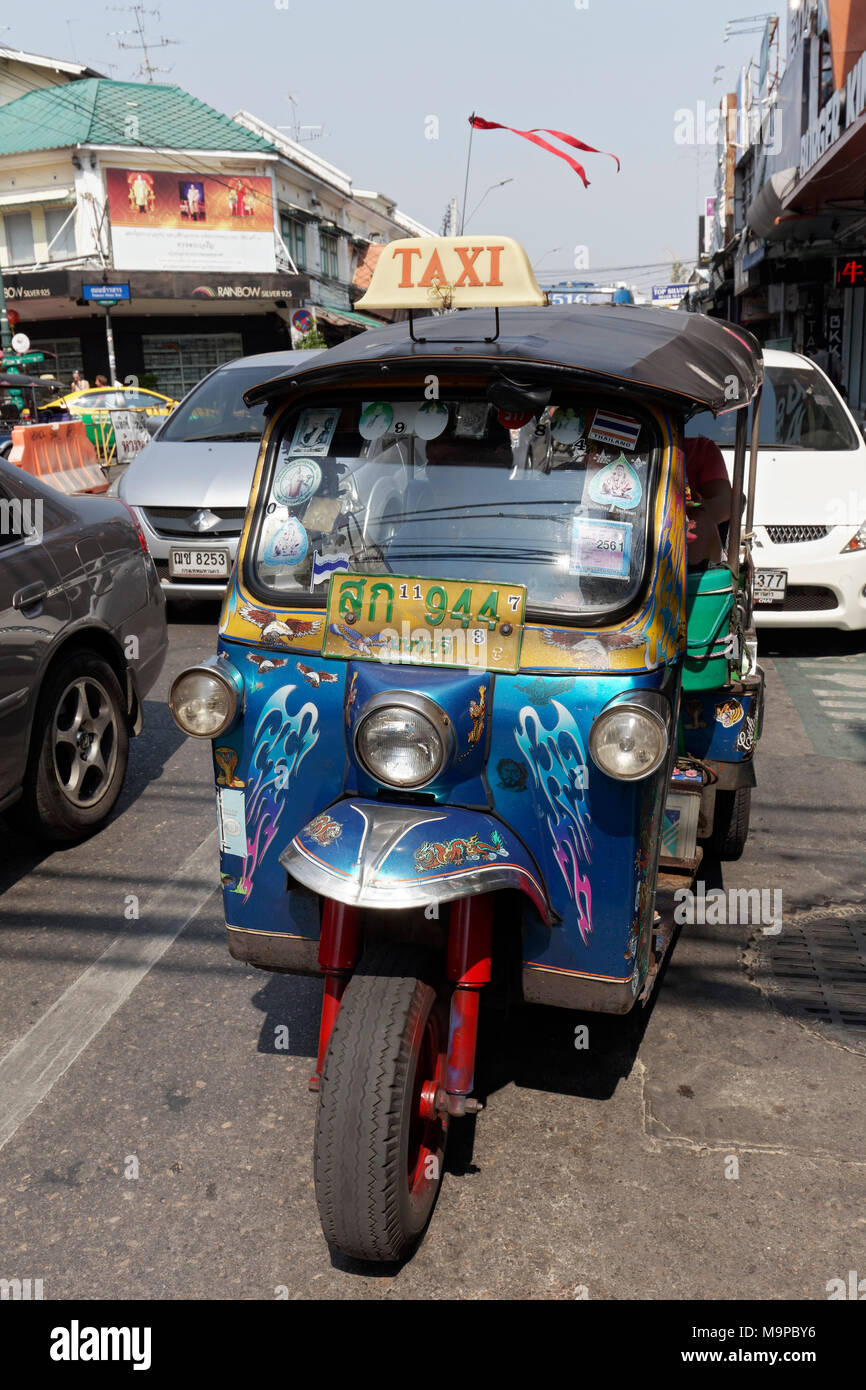 Rickshaw, Tuk Tuk Taxi in road traffic, Bangkok, Thailand Stock Photo