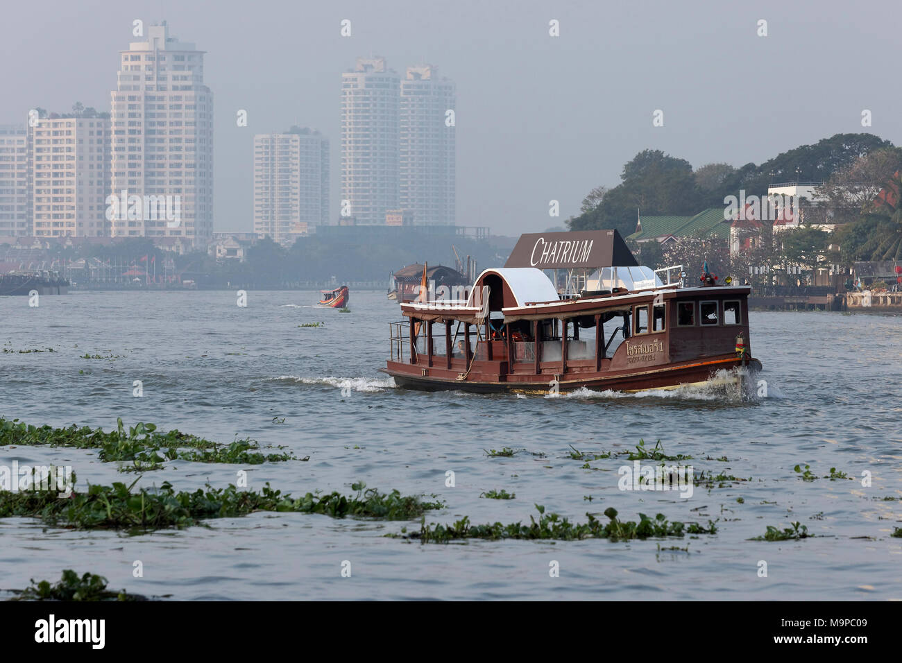 Passenger ferry of the Hotel Chatrium Riverside on the Mae Nam Chao Phraya River, Sathon, Bangkok, Thailand Stock Photo