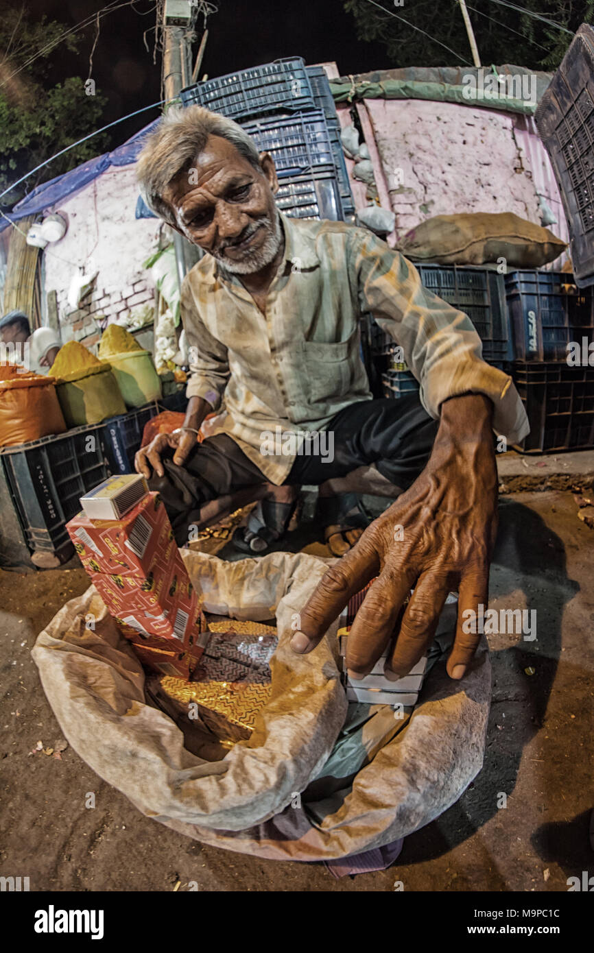 Street vendor for matches at a market, New Delhi, India Stock Photo