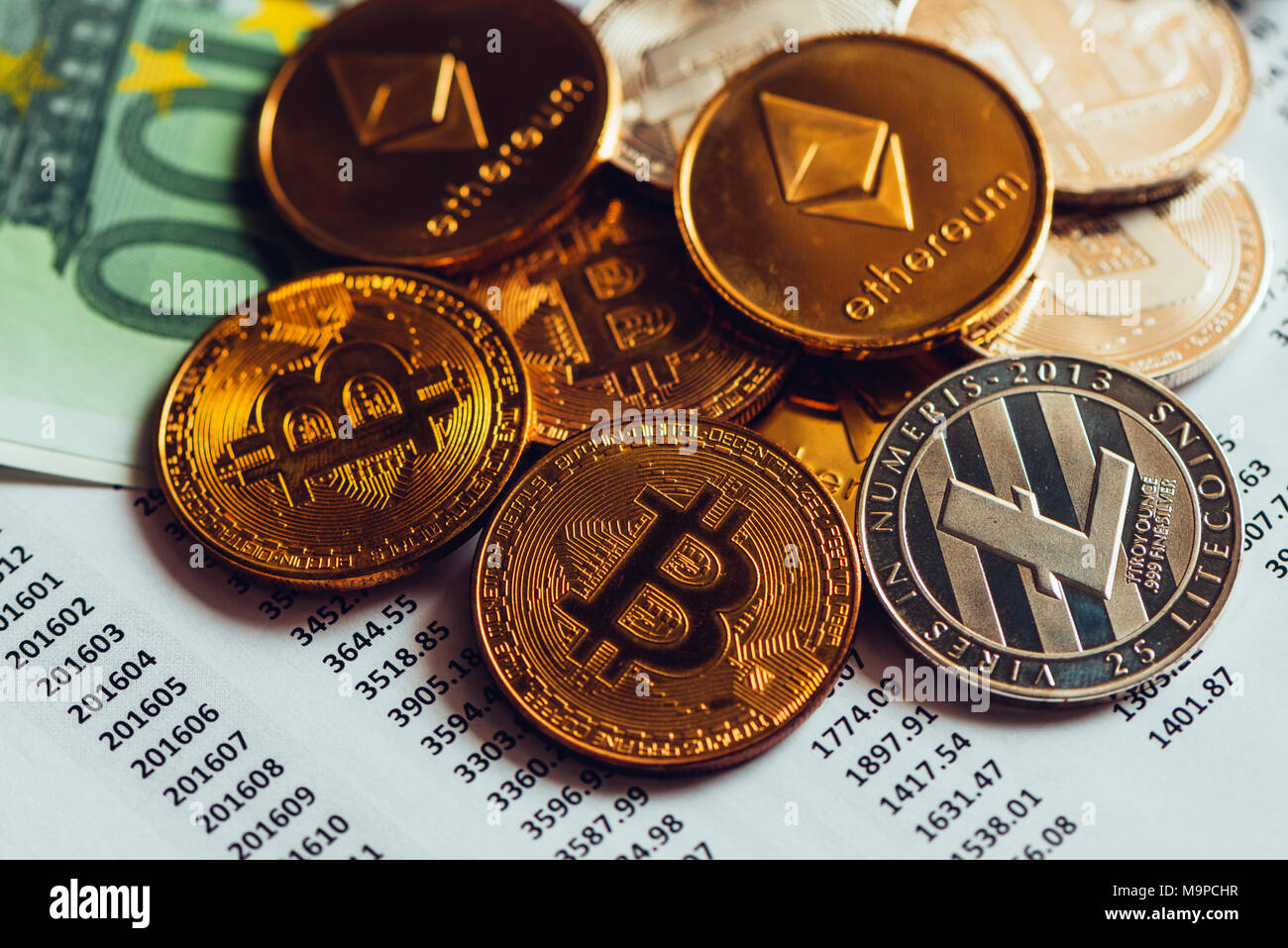 Cryptocurrency coins with exchange rate table, various crypto money with  traditional Euro currency banknotes on business office desk Stock Photo -  Alamy