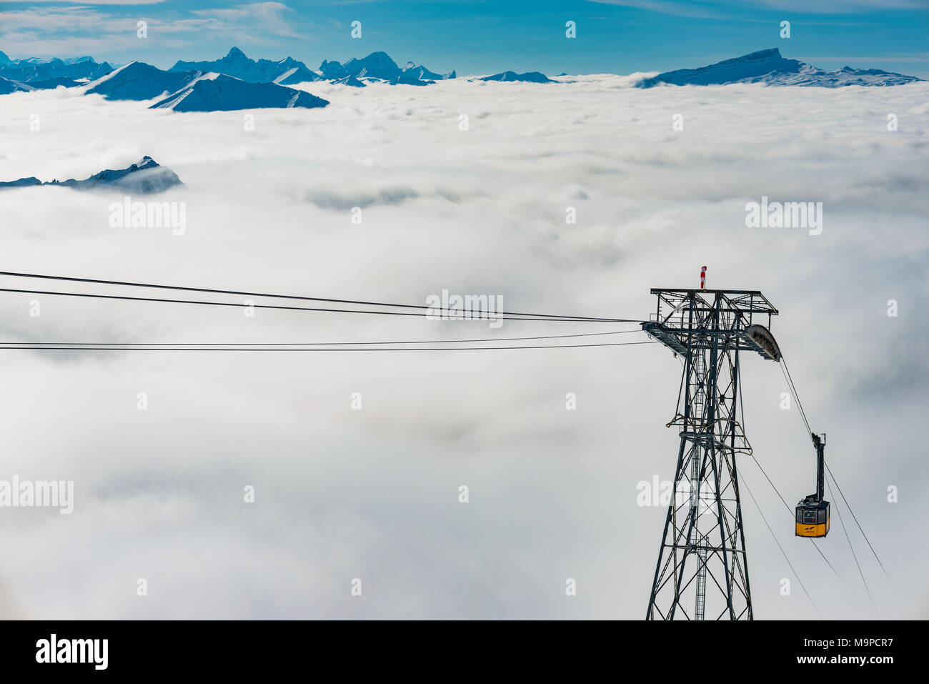 Mountain peaks protrude from clouds, cable car to station Höfatsblick, Nebelhorn, 2224m, near Oberstdorf, Allgäu Alps, Allgäu Stock Photo