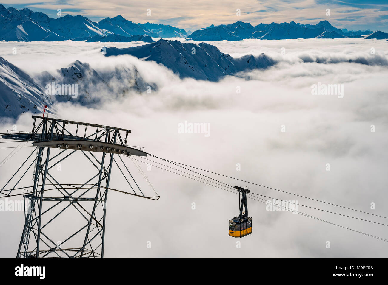 Mountain peaks protrude from clouds, cable car to station Höfatsblick, Nebelhorn, 2224m, near Oberstdorf, Allgäu Alps, Allgäu Stock Photo