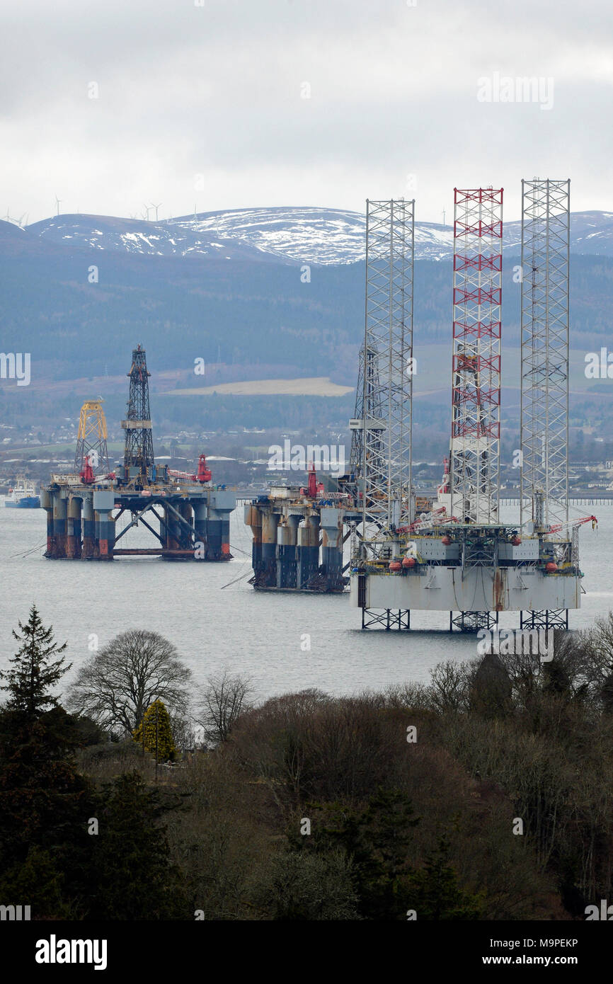 Cromarty, Scotland, United Kingdom, 27, March, 2018. Oil rigs laid up in the Cromarty Firth in the wake of the downturn in North Sea oil production, as a leading oil expert, Professor Alex Kemp, predicts up to a further £268 billion expenditure in the North Sea in a study to be presented to the Future of Energy conference at the University of Aberdeen on Wednesday, March 28. © Ken Jack / Alamy Live News Stock Photo