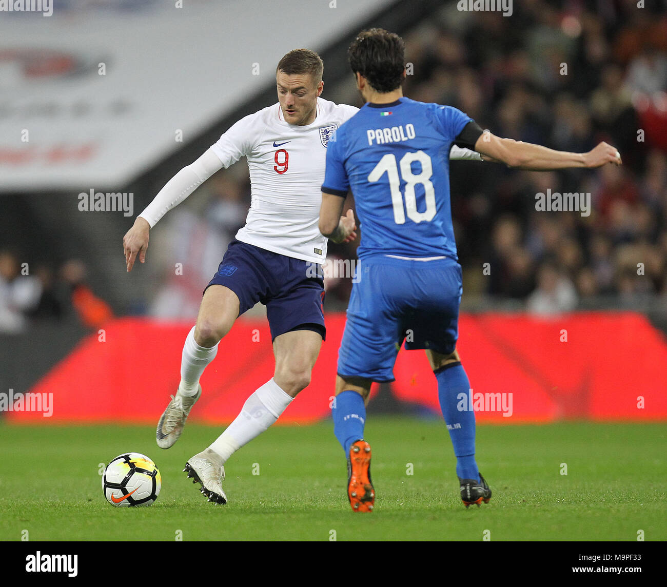 London, UK. 27th March, 2018. Jamie Vardy of England and Marco Parolo of Italy during the International Friendly match between England and Italy at Wembley Stadium on March 27th 2018 in London, England. (Photo by Matt Bradshaw/phcimages.com) Credit: PHC Images/Alamy Live News Stock Photo