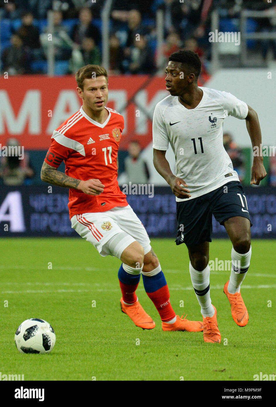 St. Petersburg, Russia. 27th Mar, 2018. Russia. St. Petersburg. March 27, 2018. Players (from left to right) Russian national team Fyodor Smolov and French national team Usman Dembele during a friendly match on soccer, between national teams of Russia and France. Credit: Andrey Pronin/ZUMA Wire/Alamy Live News Stock Photo
