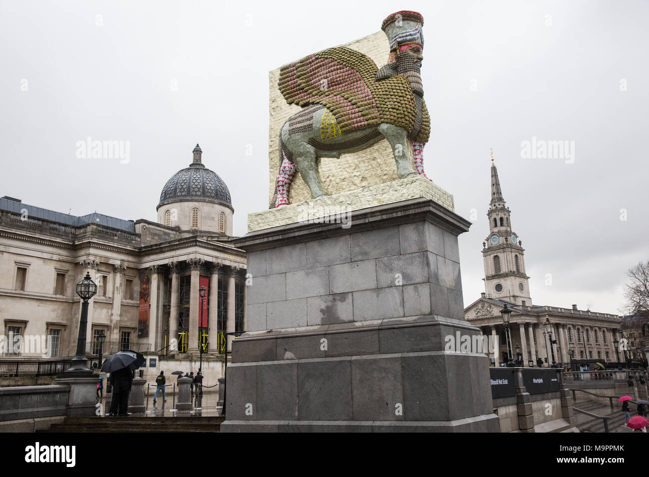 London, UK. 28th March, 2018. Michael Rakowitz’s ‘The Invisible Enemy Should Not Exist’ has been unveiled on the Fourth Plinth in Trafalgar Square. A life-size reproduction of one of the large stone statues of a lamassu (a winged bull with a human face) which guarded the gates of the ancient city of Nineveh in Iraq until destroyed by ISIS, it was armoured with 10,500 tin cans used for date syrup. It has been positioned to face towards the Foreign Office, Parliament and the Middle East. Credit: Mark Kerrison/Alamy Live News Stock Photo