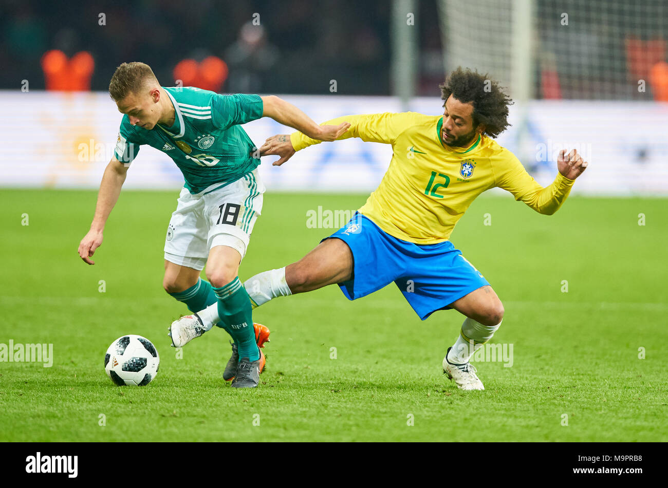Berlin, Germany. 27th Mar, 2018. DFB-ESP Football Test, Berlin, March 27, 2018 Joshua KIMMICH, DFB 18  compete for the ball against  MARCELO, BRA 12  GERMANY - BRASIL 0-1 Soccer World Cup Russia Test match , Berlin, March 27, 2018,  Season 2017/2018  © Peter Schatz / Alamy Live News Stock Photo