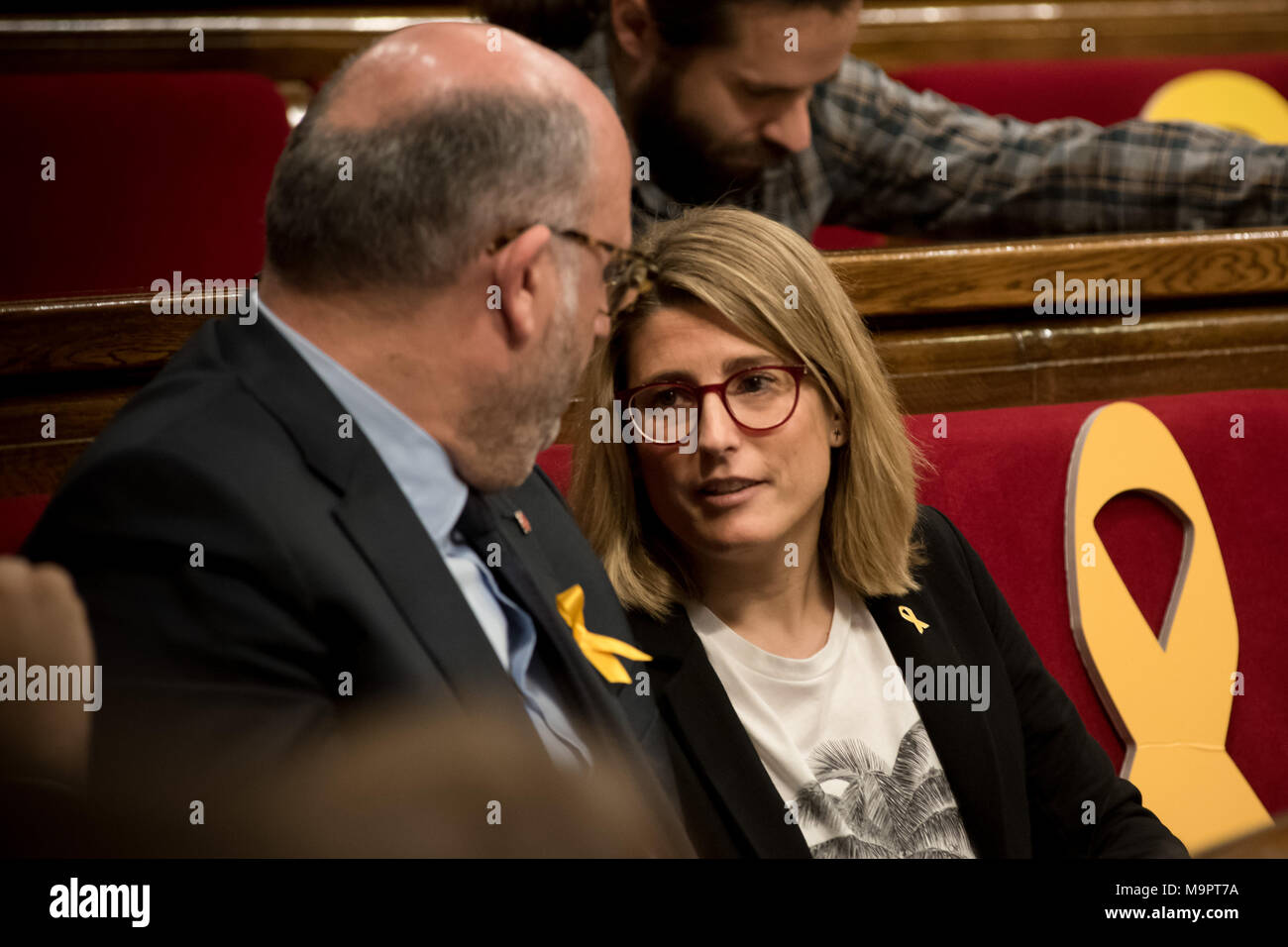 Barcelona, Catalonia, Spain. 28th Mar, 2018. Junts per Catalunya (JxCAT) member of parliament Eduard Pujol (L) speaks with Elsa Artadi during a parliament session. The independentist parties of the Catalan parliament vindicate the right of Carles Puigdemont to be invested as Catalonia president. Carles Puigdemont is being held by the German authorities after been arrested on an international warrant. Credit: Jordi Boixareu/ZUMA Wire/Alamy Live News Stock Photo