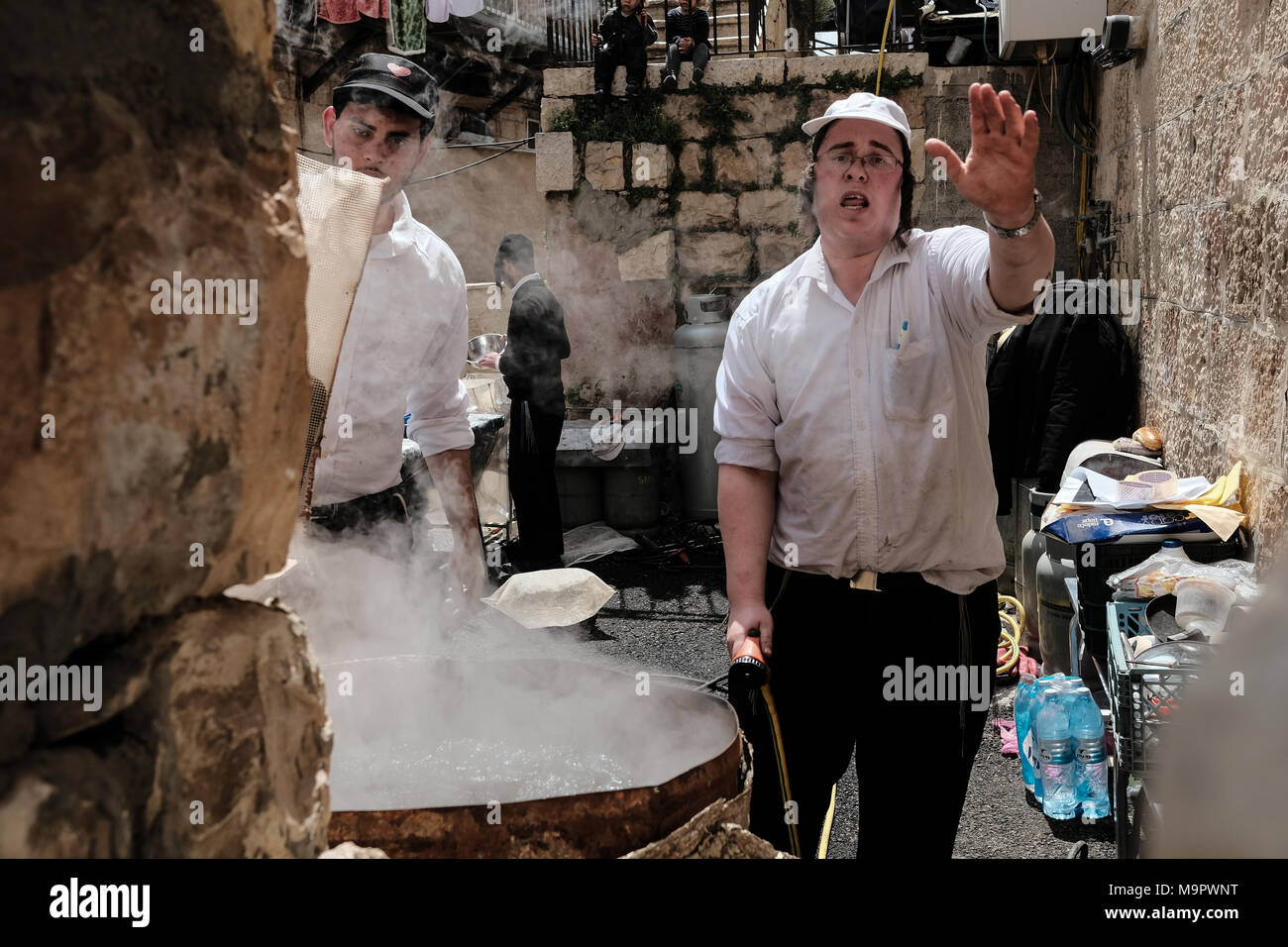 Jerusalem, Israel. 28th March, 2018. Jewish men dip dishes and eating ...