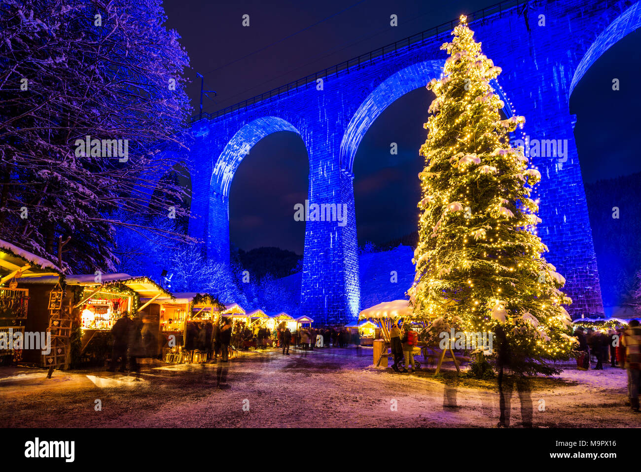 Snowy Christmas market under a railway viaduct, illuminated, Ravennaschlucht, Höllental near