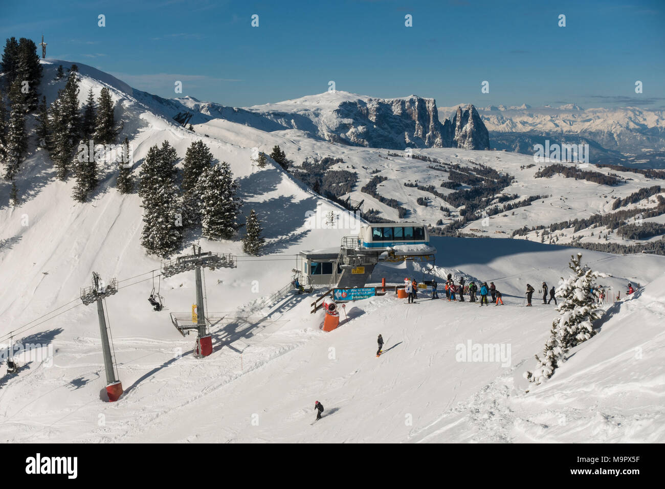 Sella Ronda ski area, Ciampinoi cable cars, in the back Alpe di Siusi and Sciliar massif, Selva di Val Gardena, South Tyrol Stock Photo