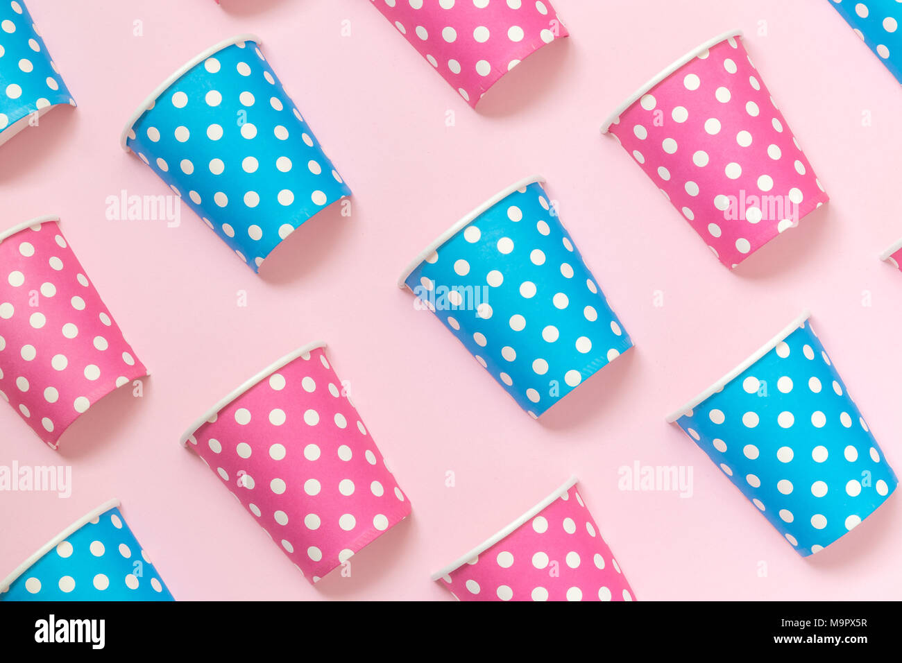 Paper cups polka design pattern on pastel pink background minimal ...